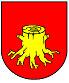 Herb przedstawia na czerwonej tarczy wizerunek wykarczowanego pnia drzewa koloru złotego.